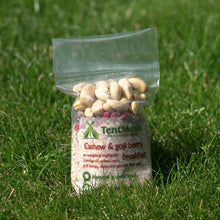 TentMeals Cashew and goji 500kcal breakfast in a field of grass