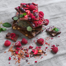 a stack of chocolate bars filled with nuts and dried fruit