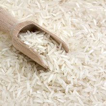 freeze dried white rice, close up with wooden scoop