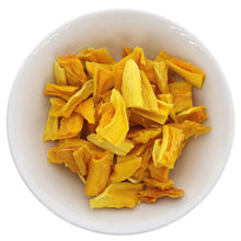 dried mango in a white bowl